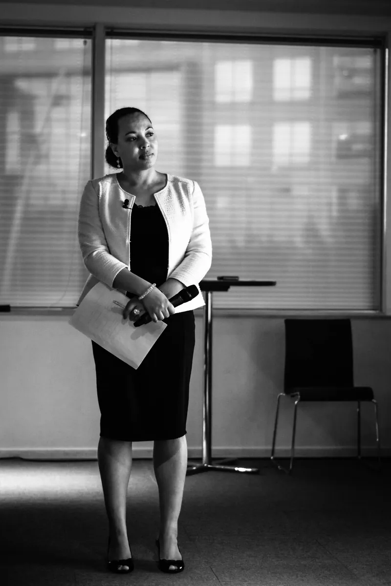 Esther speaking with a microphone
